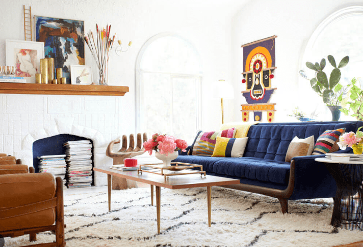 navy blue sofa and furry carpet