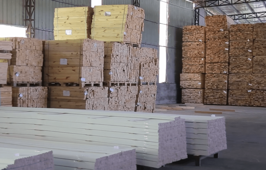 The factory is piled high with wood products and raw materials